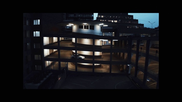 Video Reference: Building, Window, Rectangle, Fixture, Urban design, Font, Tints and shades, Condominium, Technology, Symmetry