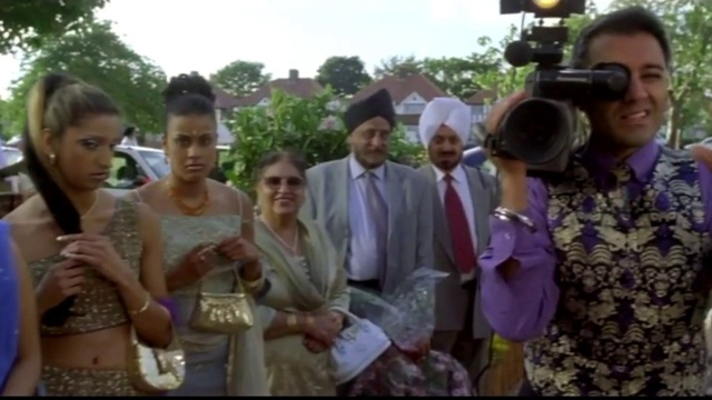 Video Reference: Smile, Temple, Tie, Sky, Happy, Hat, Adaptation, Crowd, Tree, Formal wear