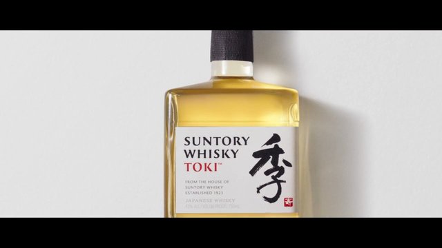 Video Reference: whisky, bottle, suntory, toki, alcohol, spirits, product shot, close-up, glass bottle, liquid, label, packaging, minimal background, drink, japanese whisky
