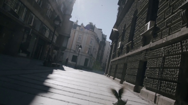 Video Reference: Sky, Building, Window, Road surface, Grey, Flooring, Wood, City, Alley, Tints and shades