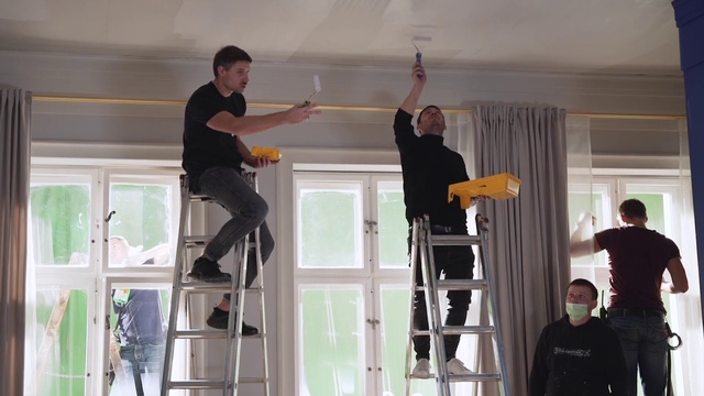 Video Reference: Trousers, Arm, Gesture, Wall, Window, Real estate, T-shirt, Event, Ladder, Fun