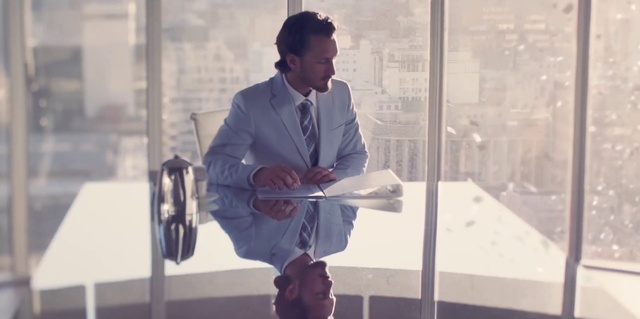 Video Reference: Dress shirt, Microphone, Standing, Tie, Blazer, White-collar worker, Eyewear, Glass, Audio equipment, Event