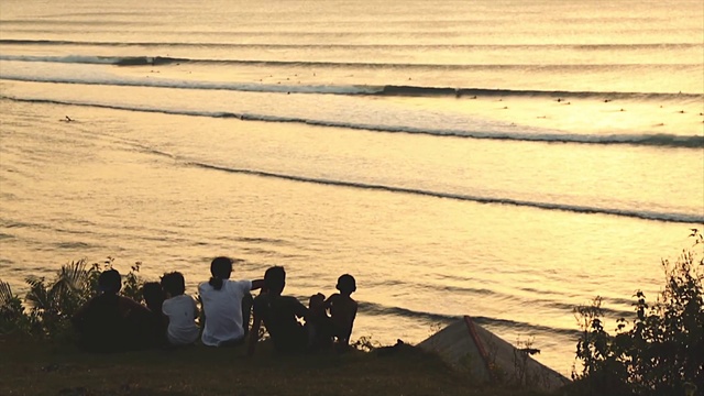 Video Reference: Water, People on beach, Body of water, People in nature, Beach, Dusk, Wood, Coastal and oceanic landforms, Sunlight, Sunrise