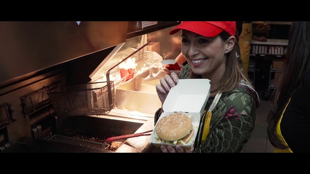 Video Reference: Smile, Human body, Flash photography, Cap, Automotive lighting, Food, Baseball cap, Automotive design, Cuisine, Dish