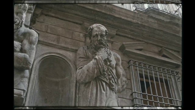 Video Reference: Sculpture, Building, Statue, Art, Facade, Monument, Window, Classical sculpture, City, Relief