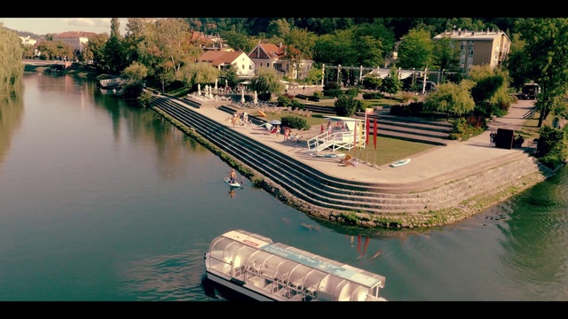 Video Reference: Water, Plant, Water resources, Boat, Tree, Building, Urban design, Lake, Landscape, Bank