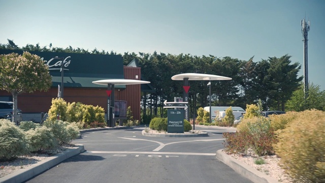 Video Reference: Plant, Sky, Shade, Tree, Asphalt, Road surface, Public space, Gasoline, Leisure, Residential area