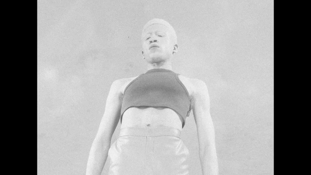 Video Reference: Neck, Sleeve, Gesture, Grey, Style, Black-and-white, Waist, Chest, Monochrome photography, Monochrome