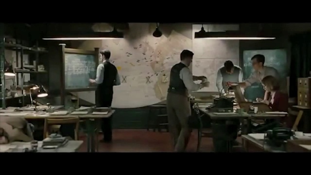 Video Reference: Table, Shirt, Standing, Event, Desk, Display device, Whiteboard, T-shirt, Job, Room