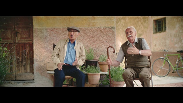 Video Reference: Trousers, Bicycle wheel, Plant, Flash photography, Happy, Font, Grass, Event, Hat, Sitting
