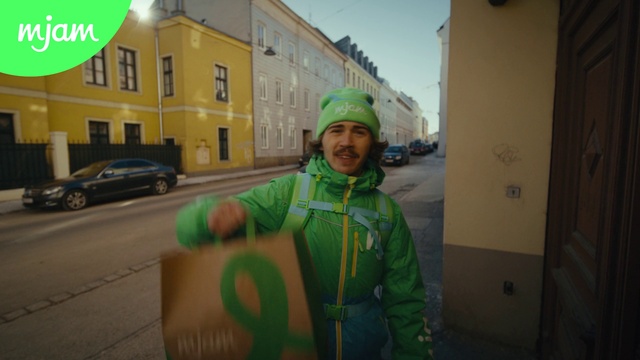 Video Reference: Tire, Land vehicle, Window, Green, Car, Building, Wheel, Sky, Road surface, Asphalt