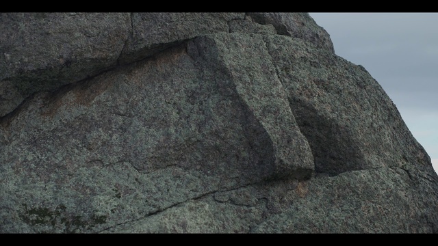 Video Reference: Bedrock, Grey, Font, Artifact, Rectangle, Monochrome photography, Outcrop, Rock, Pattern, Road surface