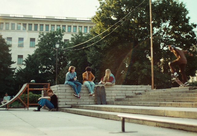 Video Reference: skateboard, skatepark, outdoor, young people, action, jump, urban, stairs, ramp, friends, summer, concrete, tree, building, leisure