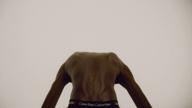 Video Reference: Arm, Neck, Sleeve, Gesture, T-shirt, Waist, Elbow, Wood, Fashion design, Landscape