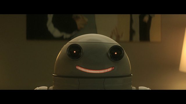Video Reference: robot, cute, smiling, android, ai, technology, futuristic, close-up, indoors, toy, device, screen, warm light, fiction, machine, portrait