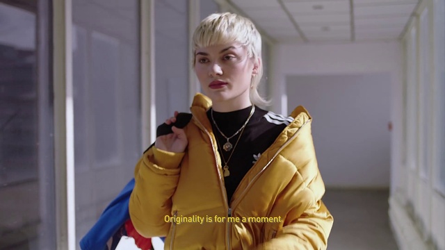 Video Reference: Sleeve, Gesture, Fashion design, Glove, Jewellery, Necklace, Microphone, Electric blue, Blond, Bangs