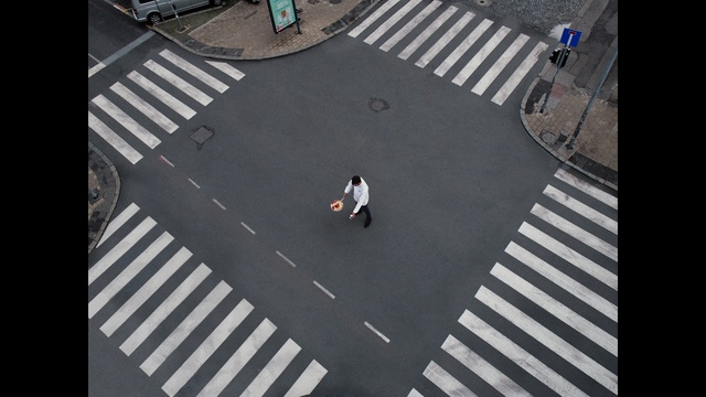 Video Reference: Infrastructure, Road surface, Zebra crossing, Asphalt, Urban design, Line, Parallel, Road, Pedestrian crossing, Composite material