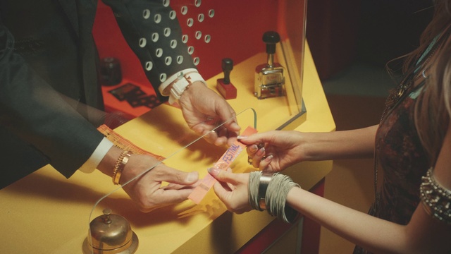 Video Reference: Hand, Bottle, Finger, Safety glove, Nail, Thumb, Wrist, Table, Blazer, Fashion design