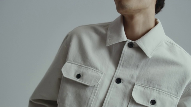 Video Reference: Outerwear, Shoulder, Dress shirt, Neck, Sleeve, Gesture, Grey, Collar, Tie, Blazer