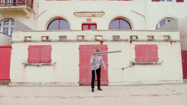 Video Reference: Window, Wall, Facade, Travel, Font, Leisure, City, Street, Umbrella, Magenta