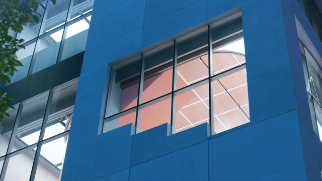 Video Reference: Daytime, Building, Blue, Azure, Window, Rectangle, Material property, Tints and shades, Facade, Electric blue