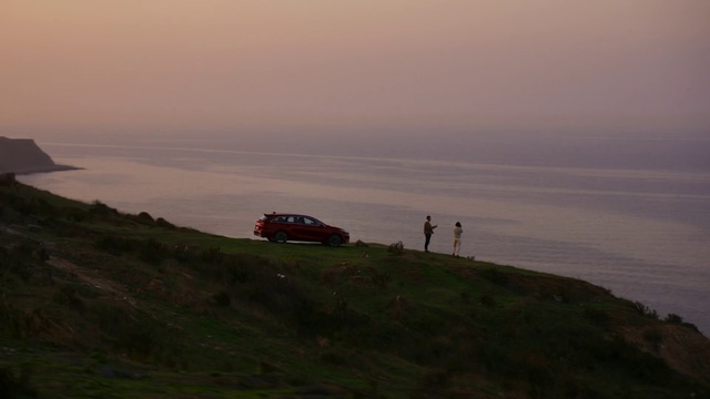 Video Reference: Cloud, Sky, Land vehicle, Water, Tire, Vehicle, Car, Highland, Coastal and oceanic landforms, Atmospheric phenomenon