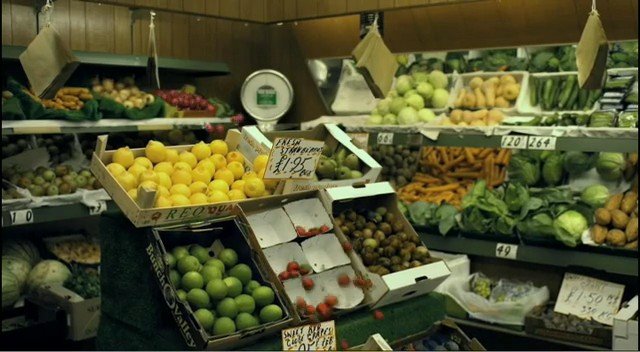 Video Reference: market, produce, fruits, vegetables, grocery, fresh, display, crates, apples, lemons, limes, bananas, greens, indoor, retail, food