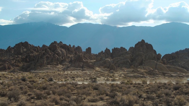 Video Reference: Cloud, Sky, Plant, Mountain, Plant community, Bedrock, Vegetation, Highland, Natural landscape, Terrain