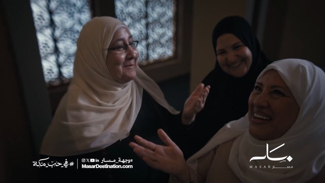 Video Reference: women, hijab, smiling, conversation, indoor, group, portrait, candid, middle eastern, window, curtains, social, promotional, arabic text, brand logo