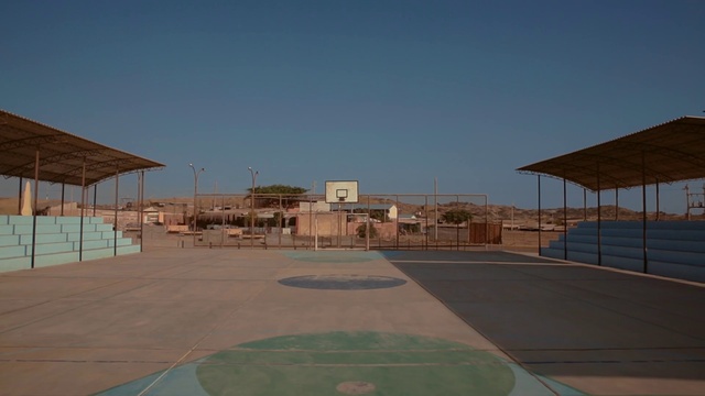 Video Reference: Sky, Road surface, Land lot, Asphalt, Shade, Landscape, City, Flooring, Facade, Urban design