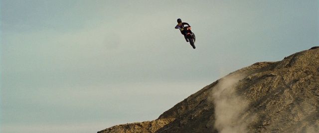 Video Reference: Sky, Cloud, Wheel, Vehicle, Tire, Helmet, Mountain, Motorcycle, Racing, Stunt
