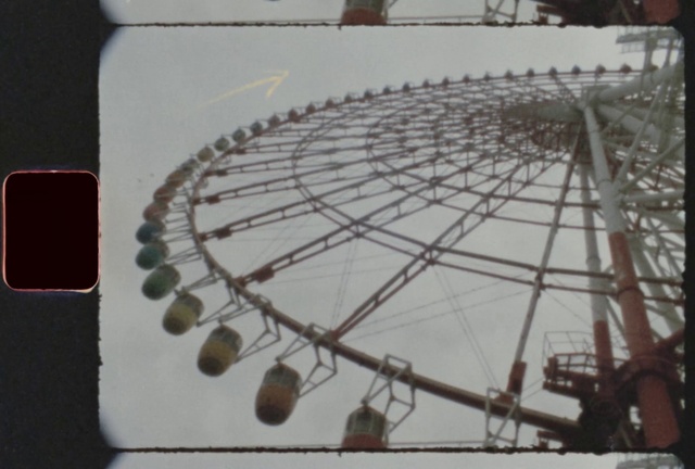 Video Reference: Ferris wheel, Urban design, Circle, Recreation, Event, Automotive wheel system, Metal, Glass, Font, Pattern