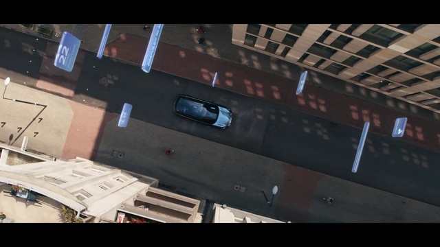 Video Reference: Font, Building, Rectangle, Automotive exterior, Space, Display device, Event, Window, Wood, Shipping box