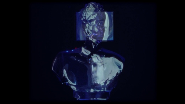 Video Reference: Jaw, Sleeve, Purple, Art, Electric blue, Entertainment, Glass, Event, Font, Personal protective equipment