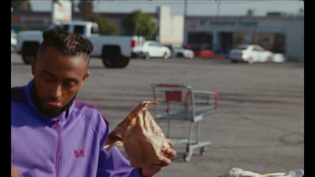 Video Reference: Food, Car, Vehicle, Travel, Asphalt, Road, Ice cream cone, Street fashion, Truck, Plastic bag