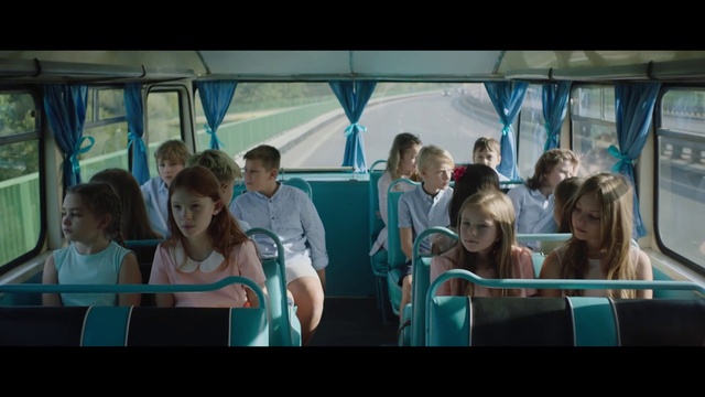 Video Reference: Hairstyle, Facial expression, Vehicle, Blue, Mode of transport, Interaction, Leisure, Travel, Public transport, Fun