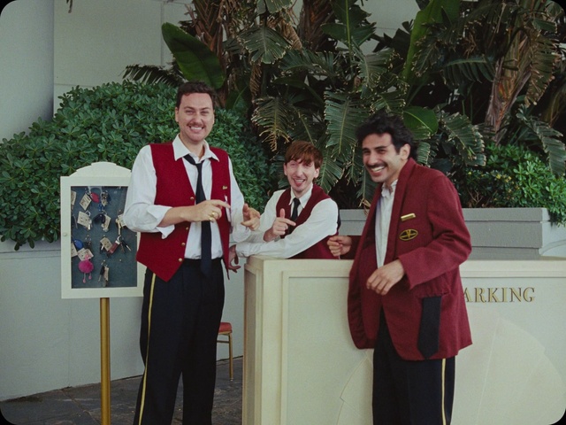 Video Reference: Smile, Plant, Picture frame, Podium, Lectern, Microphone, Houseplant, Event, Stage equipment, Tie