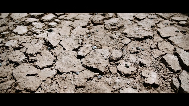 Video Reference: Road surface, Drought, Wood, Rectangle, Dry lake, Asphalt, Bedrock, Tints and shades, Pattern, Event