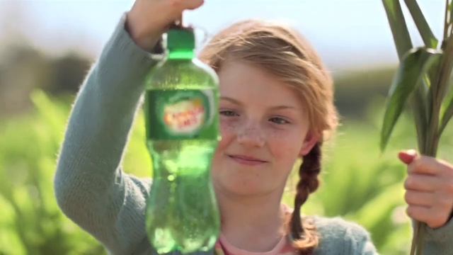 Video Reference: Bottle, Drinkware, People in nature, Glass bottle, Liquid, Happy, Gesture, Sky, Smile, Sunlight