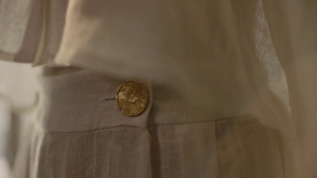 Video Reference: Brown, Sleeve, Dress shirt, Beige, Collar, Grey, Natural material, Khaki, Blazer, Button