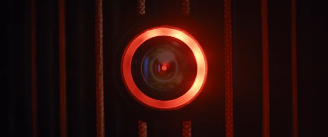 Video Reference: camera, lens, red light, close-up, abstract, dark, technology, optics, circle, glow, futuristic, macro, electronics, ambient, pattern, low light