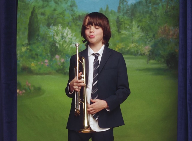 Video Reference: Plant, Musical instrument, Reed instrument, Brass instrument, Grass, Tree, Woodwind instrument, Wind instrument, Musician, Tie