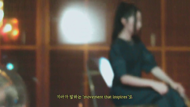 Video Reference: Wood, Fun, Entertainment, Event, Thigh, T-shirt, Room, Font, Sitting, Audio equipment