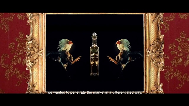 Video Reference: Drink, Alcoholic beverage, Rectangle, Font, Bottle, Art, Glass bottle, Event, Entertainment, Distilled beverage