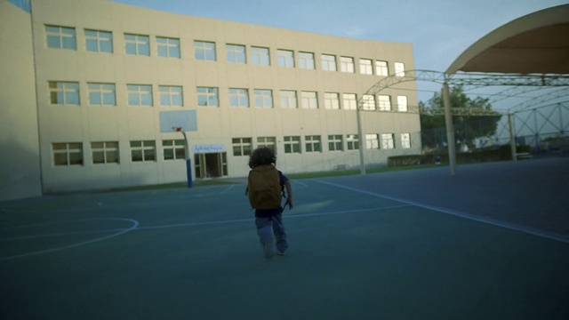 Video Reference: Sky, Property, Daytime, Building, Window, Field house, Flooring, Asphalt, Morning, Shade