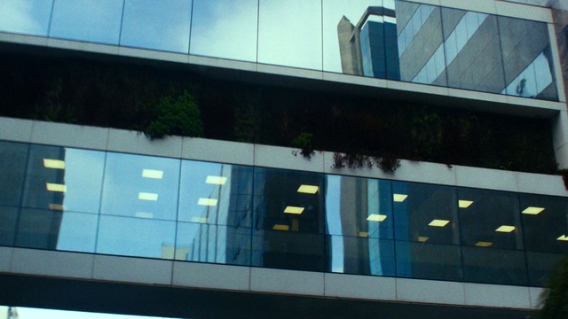 Video Reference: Building, Shade, Rectangle, Facade, Tints and shades, Commercial building, Glass, Transparent material, Metal, City
