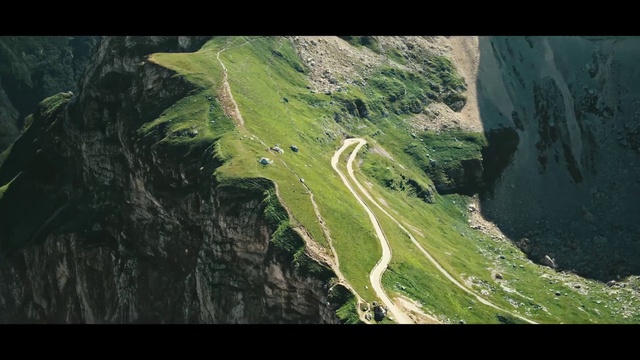 Video Reference: Mountain, Slope, Natural landscape, World, Landscape, Terrestrial plant, Valley, Grass, Road, Grassland