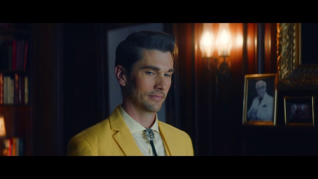 Video Reference: Forehead, Flash photography, Microphone, Blazer, Event, Formal wear, Spokesperson, White-collar worker, Picture frame, Conversation