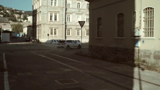 Video Reference: Window, Building, Road surface, Car, Asphalt, Vehicle, Residential area, Urban design, Road, Van