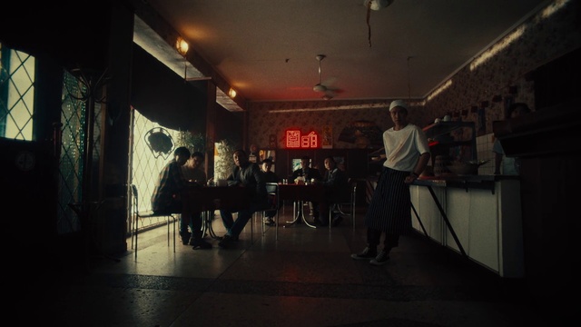 Video Reference: Musician, Chair, Entertainment, Musical instrument accessory, Building, Table, Sky, Event, Stage, Darkness